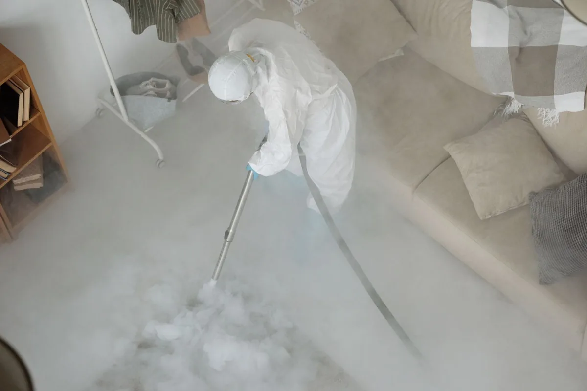 Biohazard cleanup technician in protective equipment, Springfield, OR